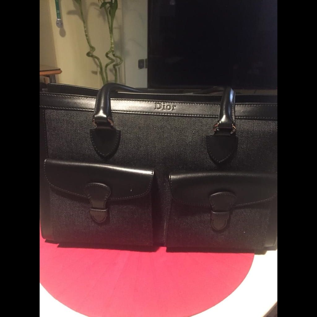 Dior black jeans and leather bag