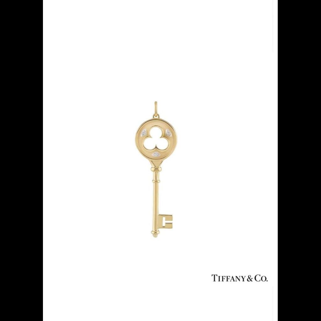 Tiffany and co original key pendant with diamonds,  18k yellow gold