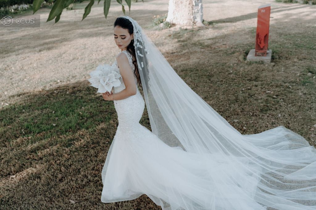 Wedding dress with veil and bouquet