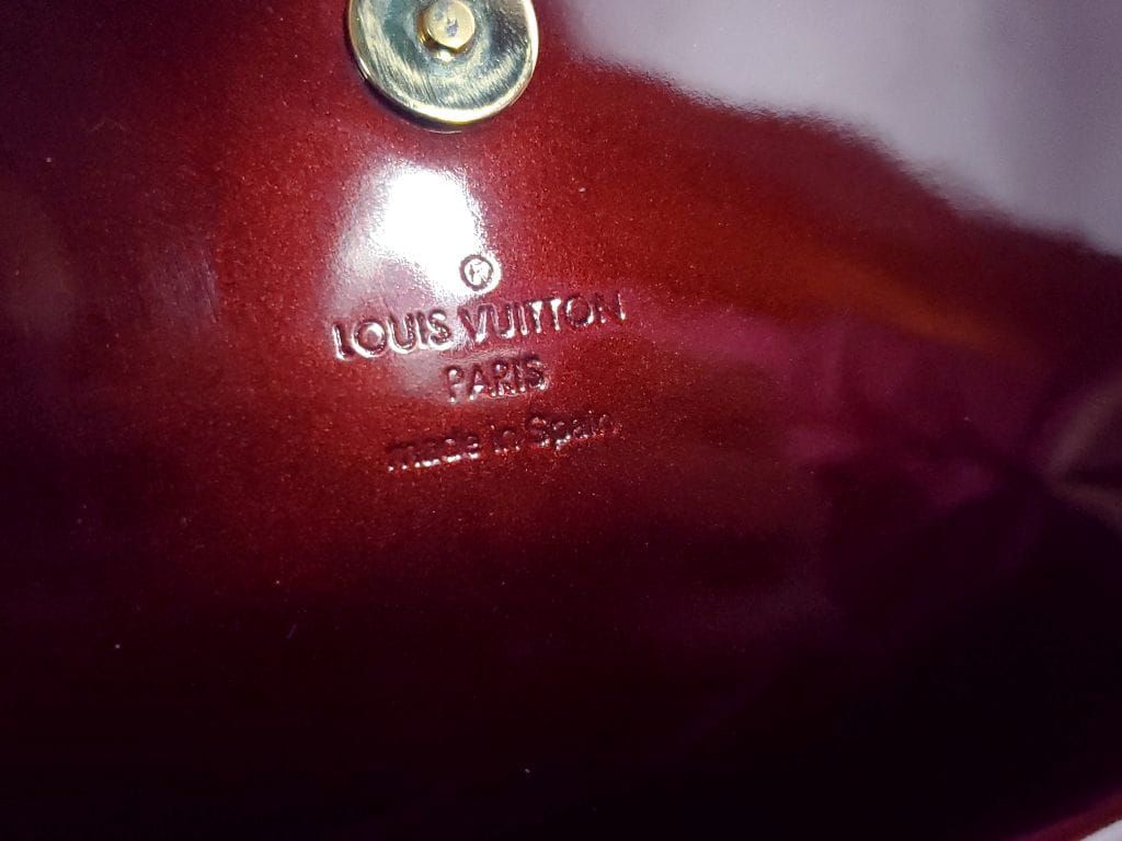 Auth , Louis Vuitton, Rouge Fauviste vernier pochette sobe clutch bag