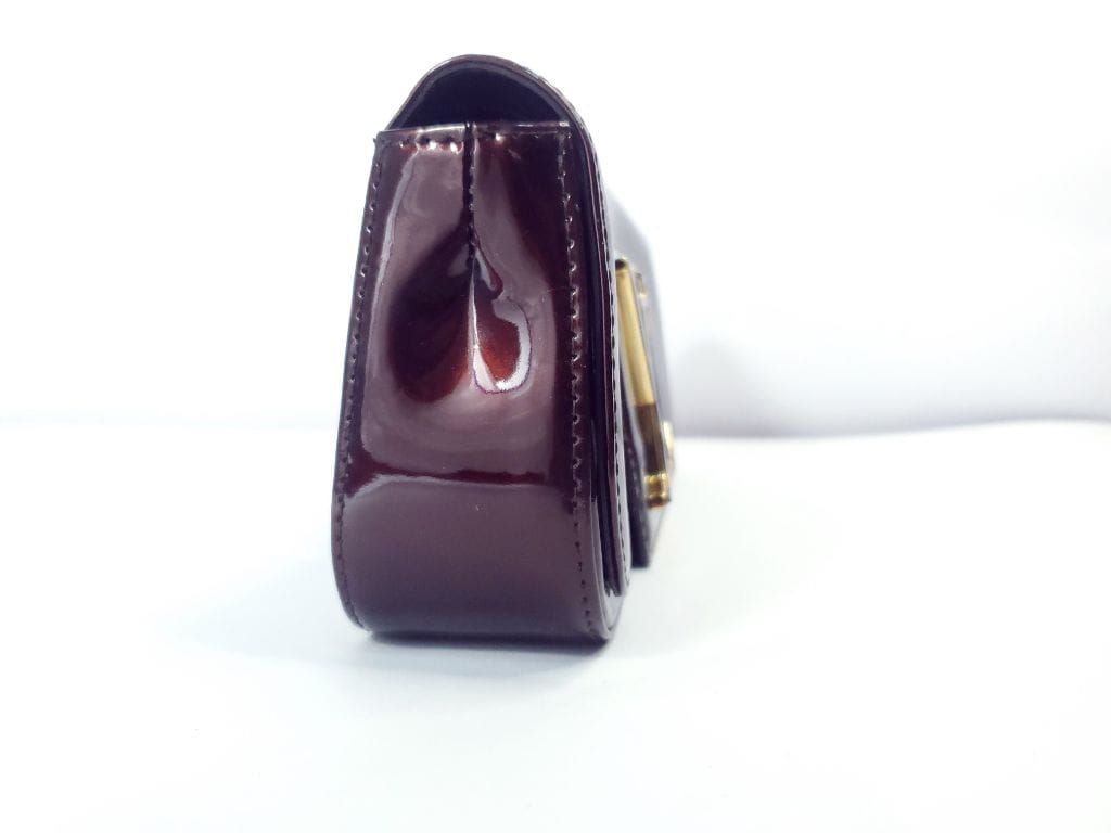 Auth , Louis Vuitton, Rouge Fauviste vernier pochette sobe clutch bag